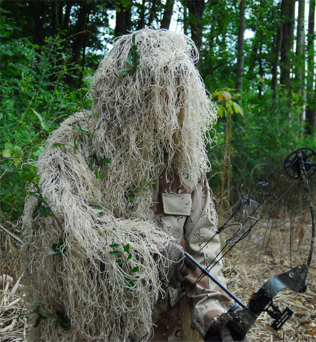 Ultra Light Ghillie Bow Hunting Jacket in Desert, shown with bow