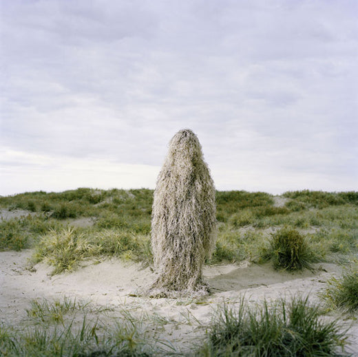 Ultra Light Ghillie Poncho in Desert color worn among sandy dunes
